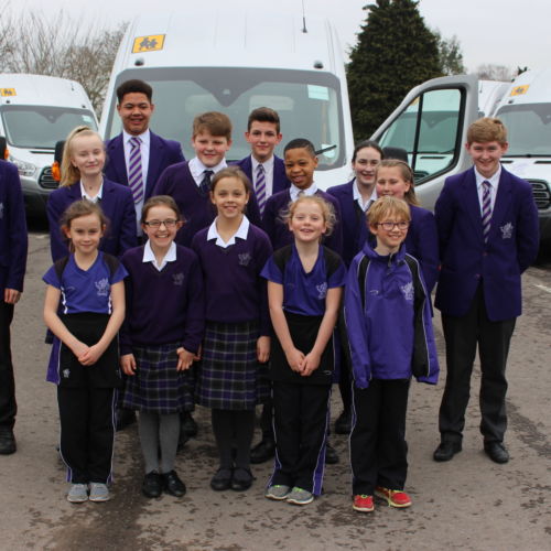 wycliffe pupils in front of minibuses