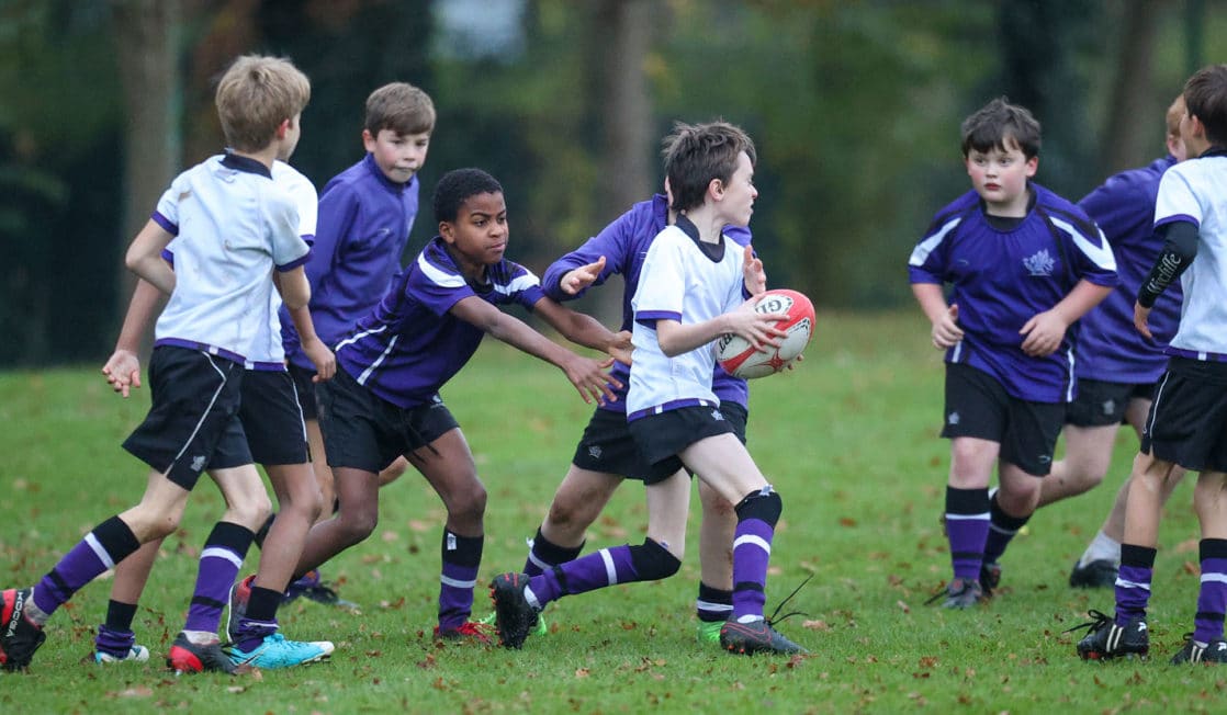 Prep school boys playing rugby