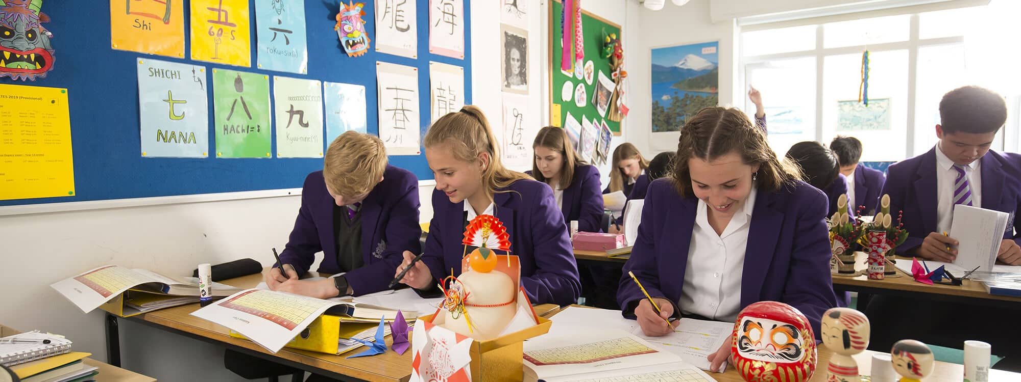 Senior School children sat at desk in classroom