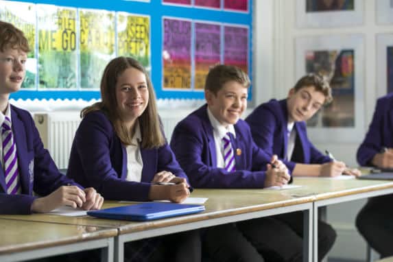 Senior school pupils looking at camera