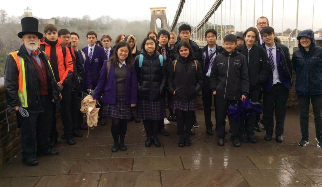 Group of Senior School pupils on trip to Bristol, with Brunel bridge in background