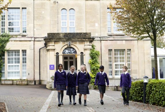 Group of school children walking together outside