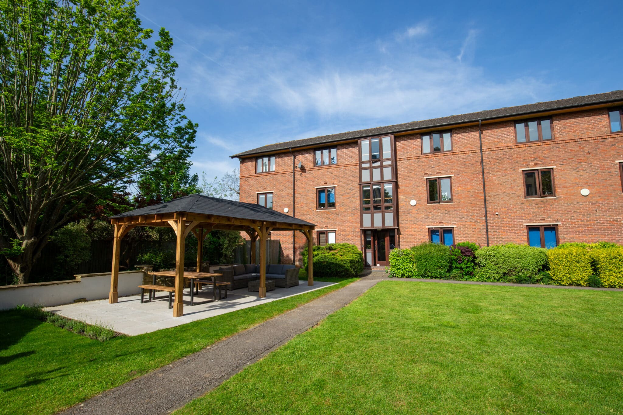 Modern red brick building with sheltered area