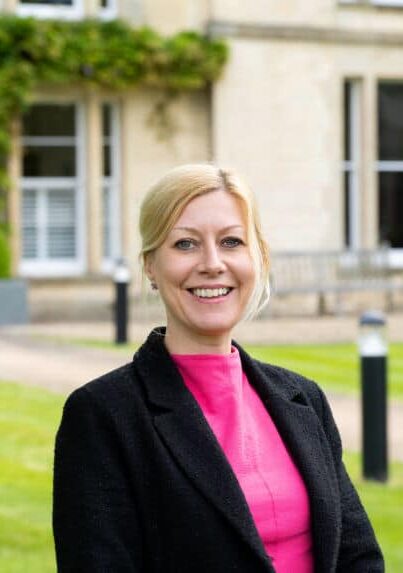 Rebekah Wilkins, wearing pink blouse with black blazer