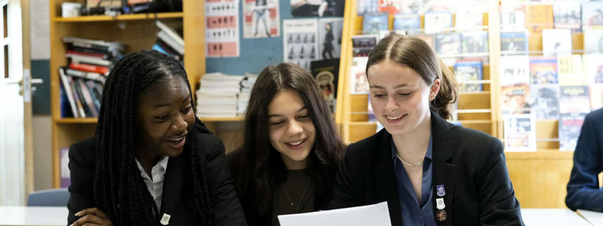 Three school girls working together