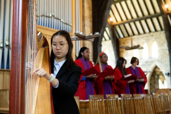 Senior school girl playing harp