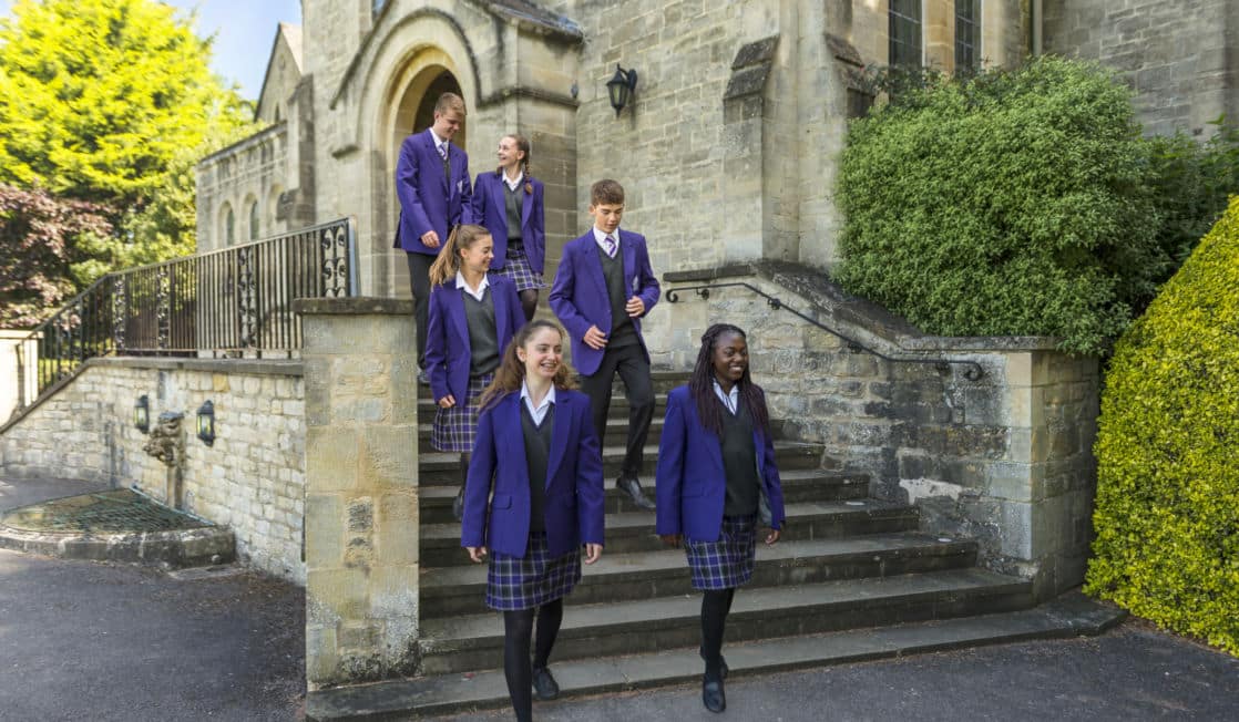 School girls and boy walking down steps