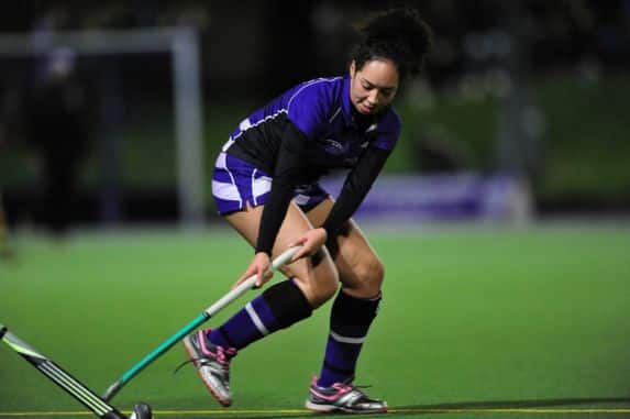 Senior school girl playing hockey