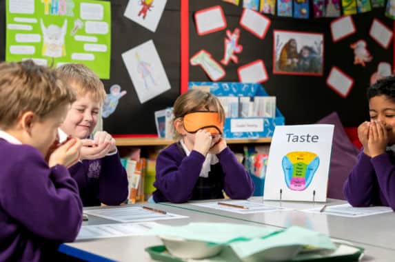 pre-prep girl wearing eye mask 'playing guess the taste'