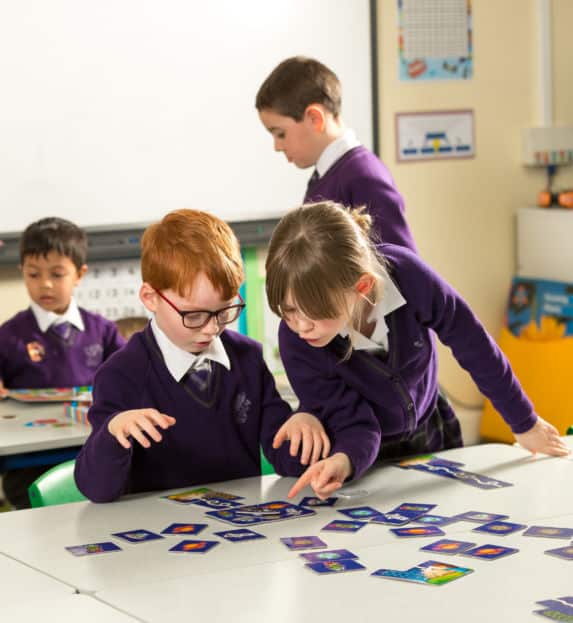 two pre-prep children playing an after school card game