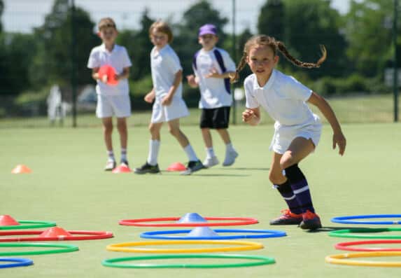 School girl playing sports activity