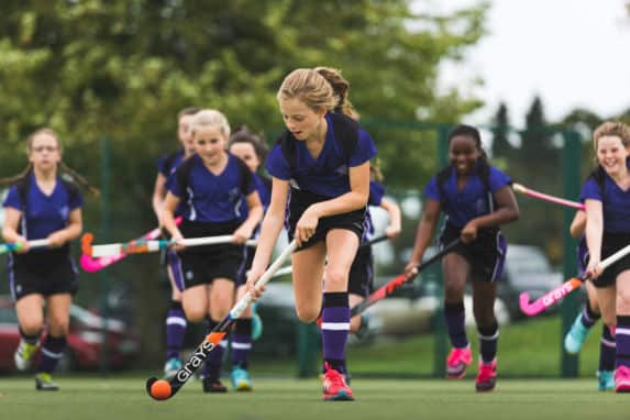 Prep school girls playing hockey