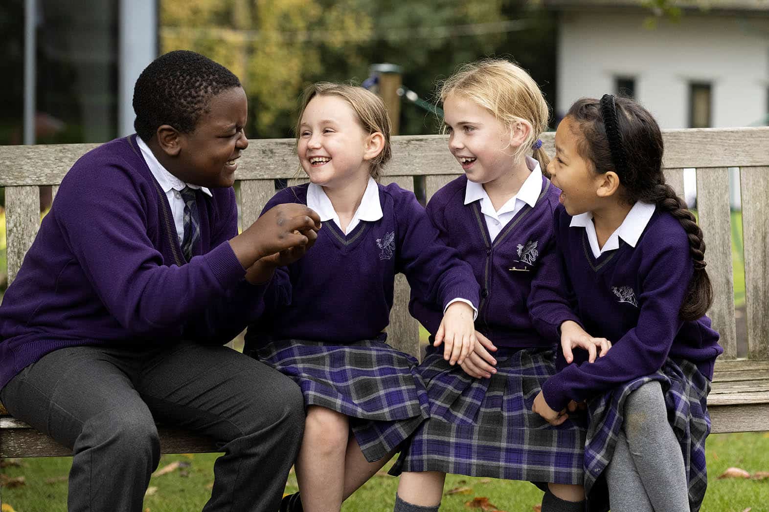 Wycliffe Prep International Pupils talking on a bench