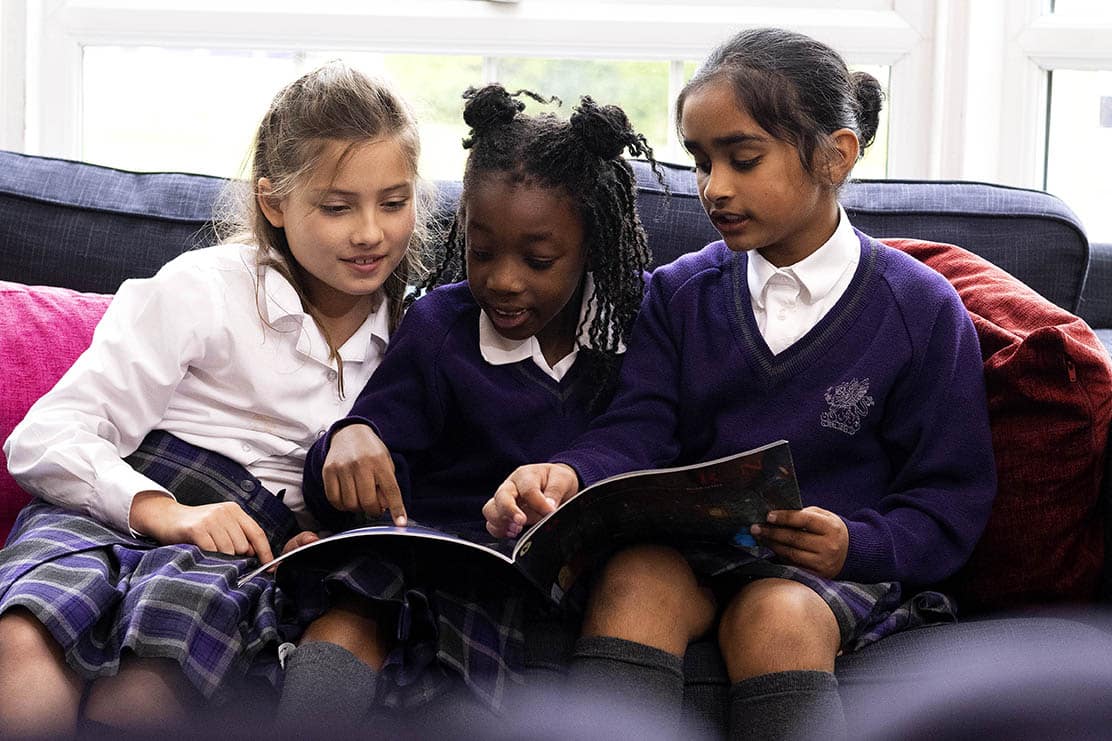 3 International girls reading image