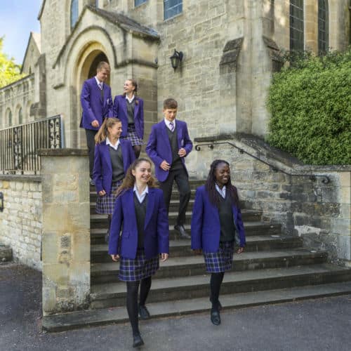 School pupils walking down church steps