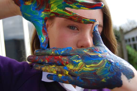 Prep pupil with painted hands image